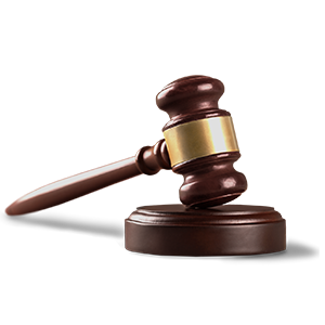 Judge's gavel resting on a wooden sound block, symbolizing judiciary authority